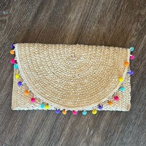 Stichfix Pom-Pom 14”x8” Straw Clutch. Excellent condition.